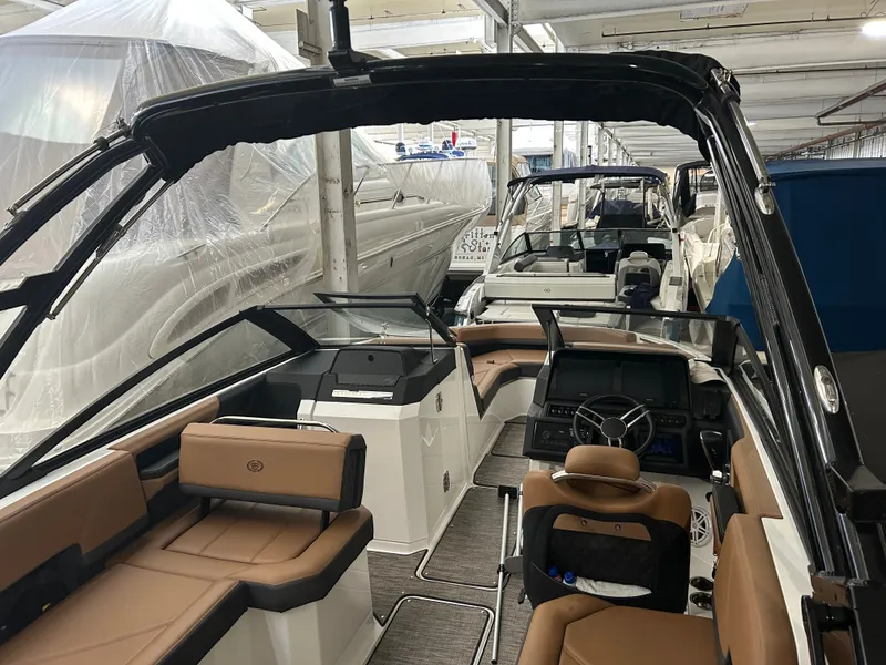 Slide: The Image of Interior view of a 2024 Cobalt R6 boat in a storage facility. - 37