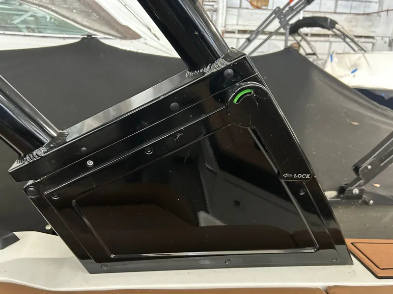 Slide: The Image of Close-up of 2024 Cobalt R6 boat locking mechanism. - 38