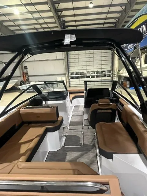 Slide: The Image of Interior view of 2024 Cobalt R6 boat with brown seating. - 43