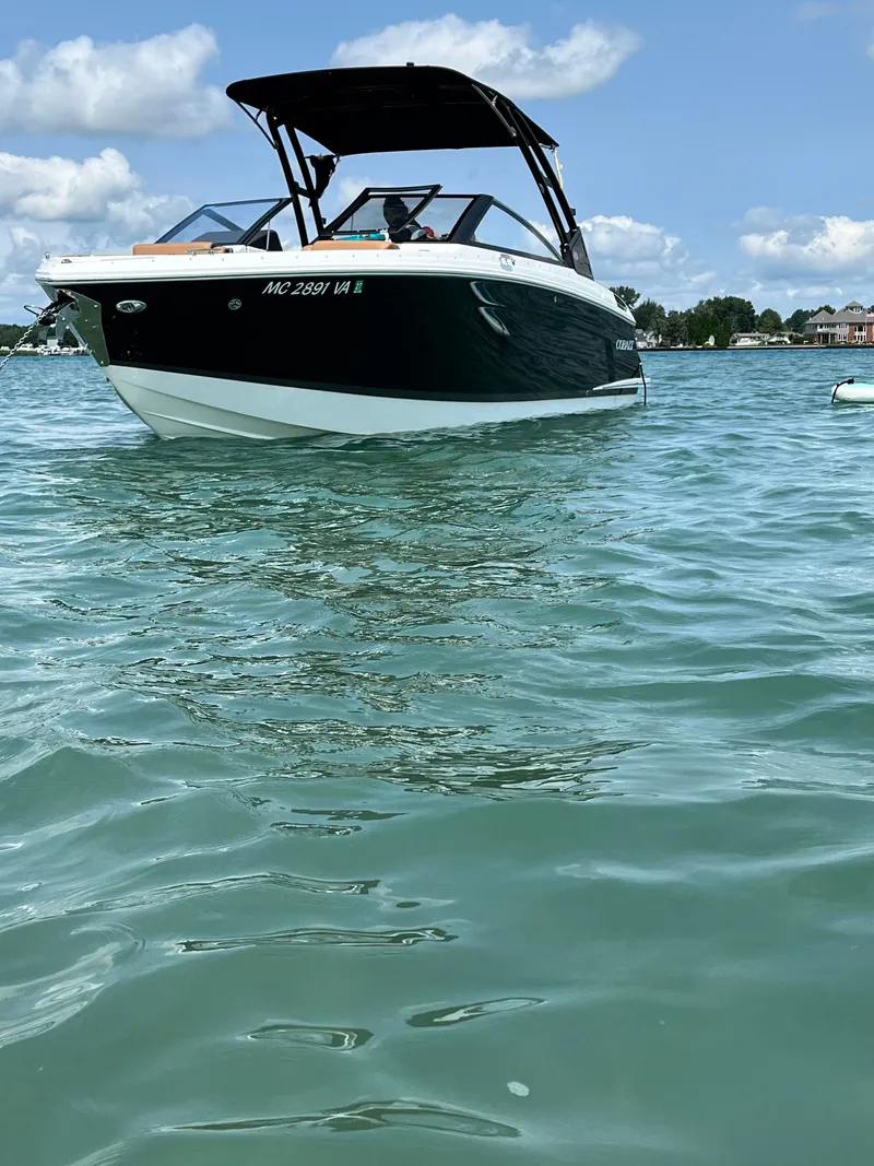 Slide: The Image of 2024 Cobalt R6 boat on calm water under sunny skies. - 45