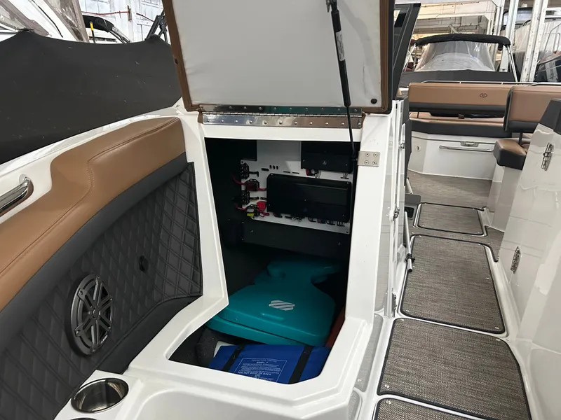 Slide: The Image of Interior of 2024 Cobalt R6 boat with open storage compartment. - 9