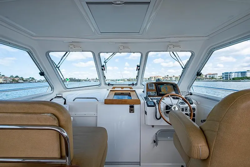 Slide: The Image of Interior view of 2011 Back Cove 30 boat cockpit with navigation equipment and seating. - 10