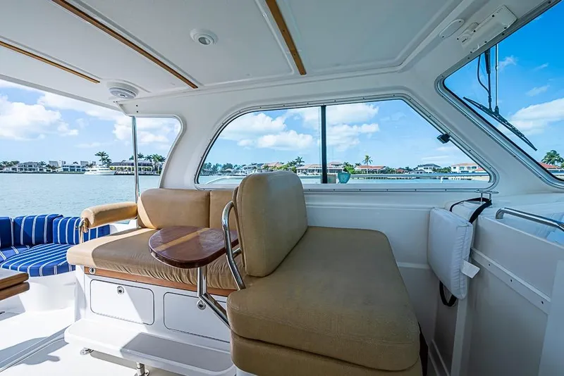 Slide: The Image of Interior view of 2011 Back Cove 30 boat with comfortable seating and scenic water view. - 12