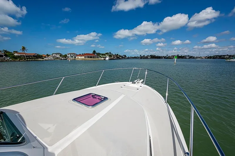 Slide: The Image of Bow view of 2011 Back Cove 30 boat on calm water under blue sky. - 27