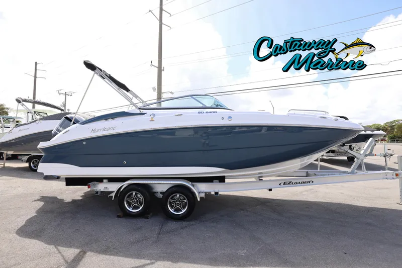 The Image of 2026 Hurricane SunDeck 2400 OB boat on trailer at Castaway Marine dealership. - 0