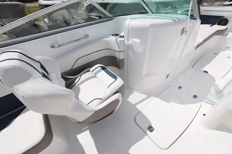 Slide: The Image of 2026 Hurricane SunDeck 2400 OB boat interior with white seating and sleek design. - 18