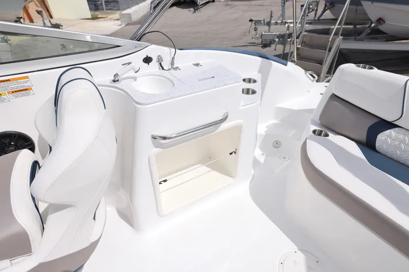 Slide: The Image of Interior of 2026 Hurricane SunDeck 2400 OB boat with seating and sink area. - 19