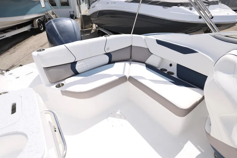 Slide: The Image of 2026 Hurricane SunDeck 2400 OB boat interior with white and gray seating. - 20