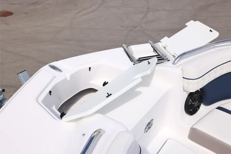 Slide: The Image of 2026 Hurricane SunDeck 2400 OB boat interior with open storage compartment and seating. - 8