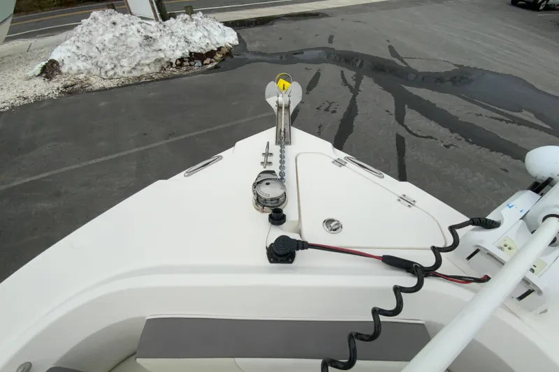 Slide: The Image of Bow view of a 2019 Century 2301 Center Console boat with anchor and equipment. - 21