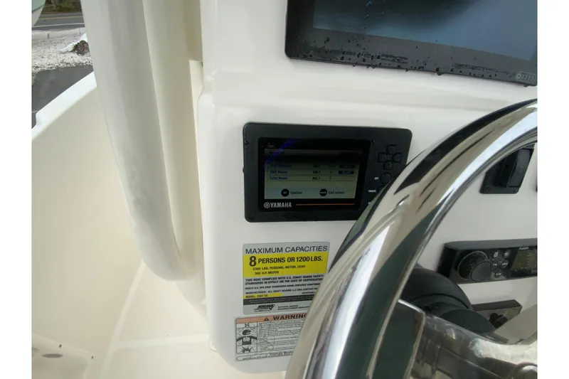 Slide: The Image of Century 2301 Center Console 2019 dashboard with Yamaha display and capacity warning label. - 25