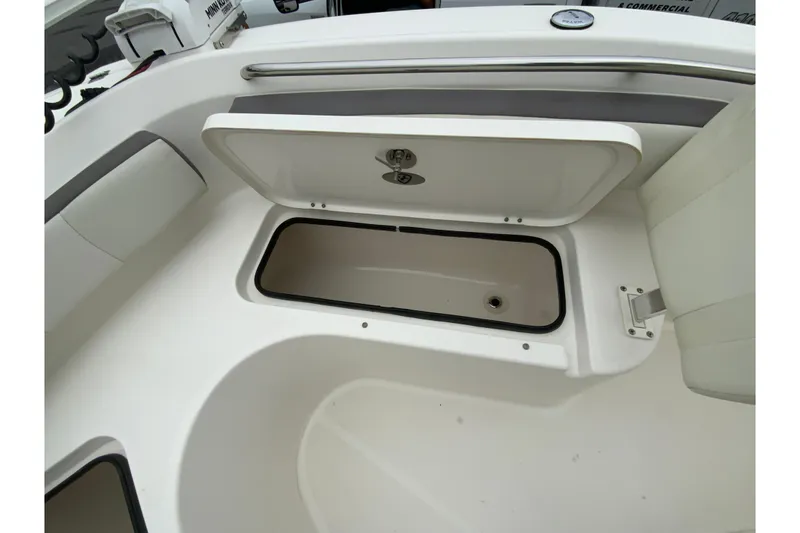 Slide: The Image of Open storage compartment on 2019 Century 2301 Center Console boat. - 26