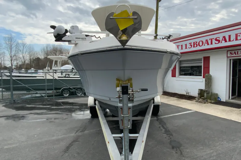 Slide: The Image of 2019 Century 2301 Center Console boat on trailer at dealership. - 4