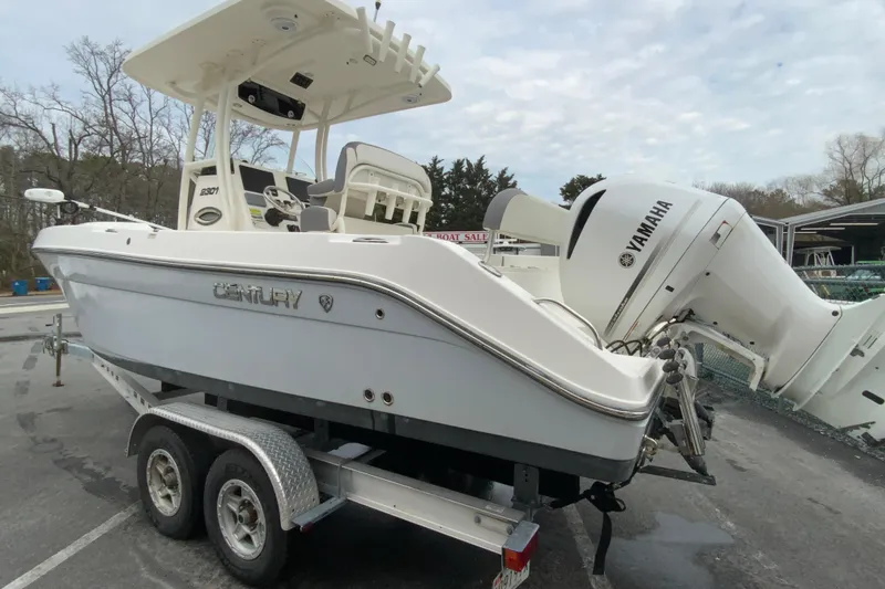 Slide: The Image of 2019 Century 2301 Center Console boat on trailer with Yamaha outboard motor. - 7