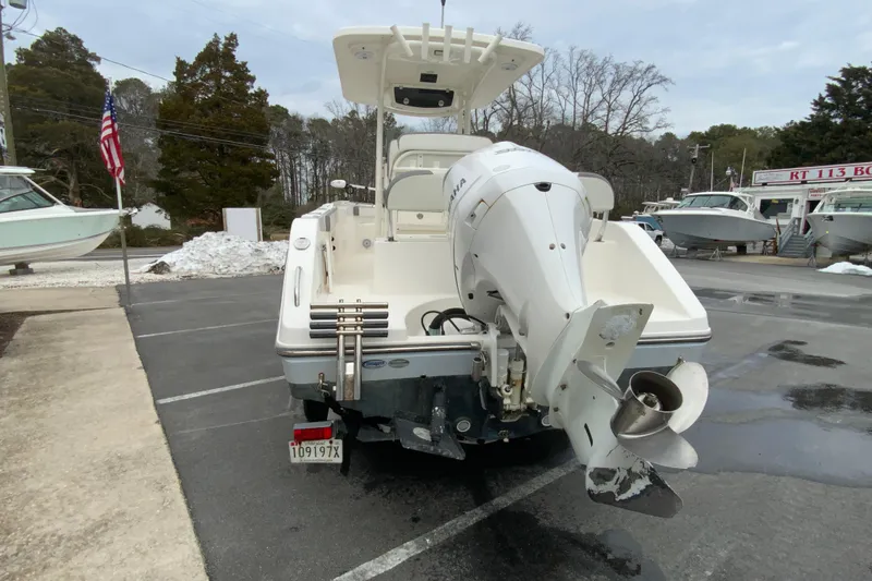 Slide: The Image of 2019 Century 2301 Center Console boat with Yamaha outboard motor in a parking lot. - 8