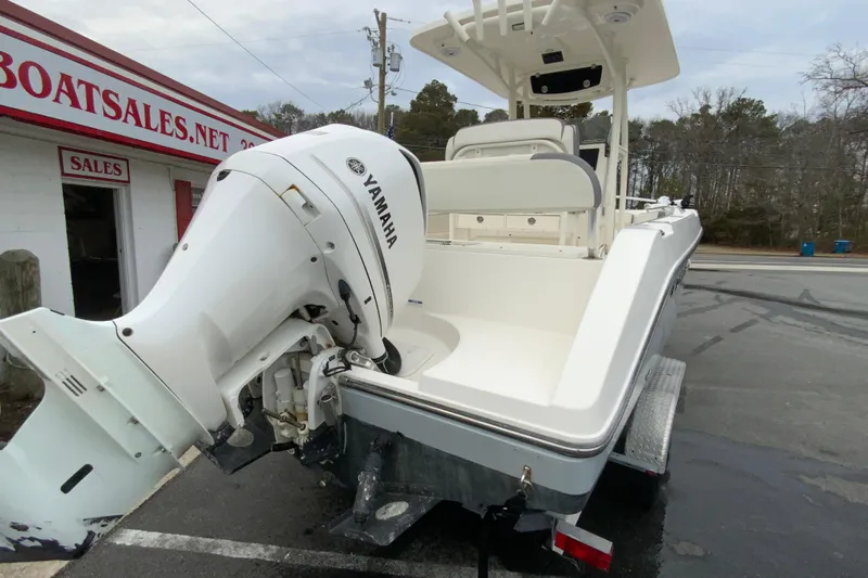 Slide: The Image of 2019 Century 2301 Center Console boat with Yamaha outboard motor at dealership. - 9