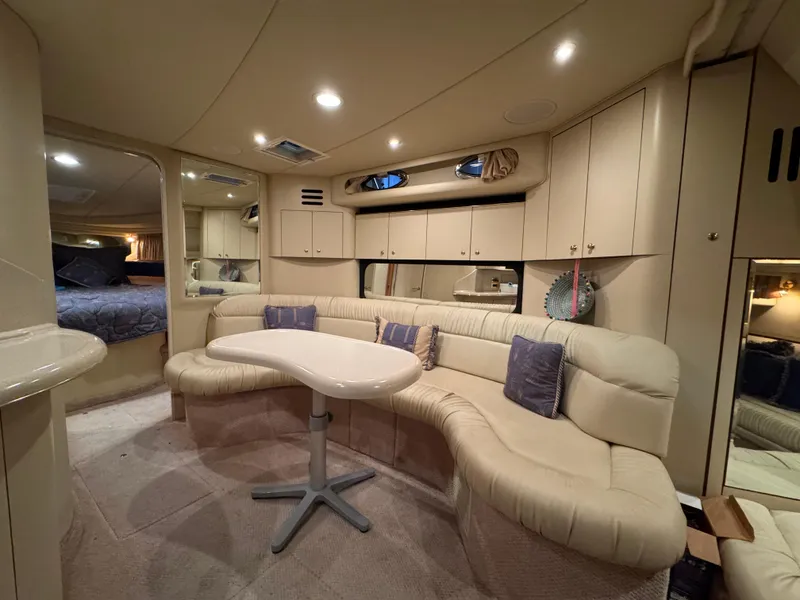 Slide: The Image of Luxurious interior of 2000 Sea Ray 380 Sundancer yacht with plush seating and modern design. - 4