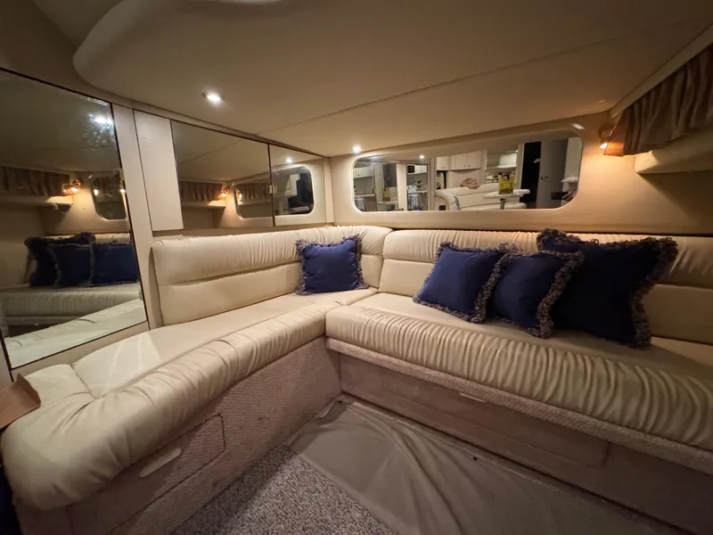 Slide: The Image of Luxurious interior of 2000 Sea Ray 380 Sundancer with plush seating and elegant decor. - 7
