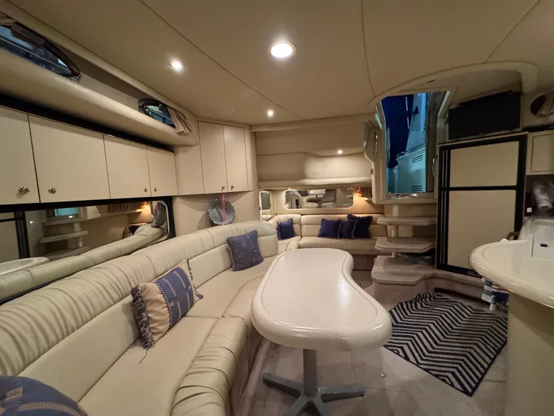 Slide: The Image of Luxurious interior of 2000 Sea Ray 380 Sundancer yacht with plush seating and modern amenities. - 8