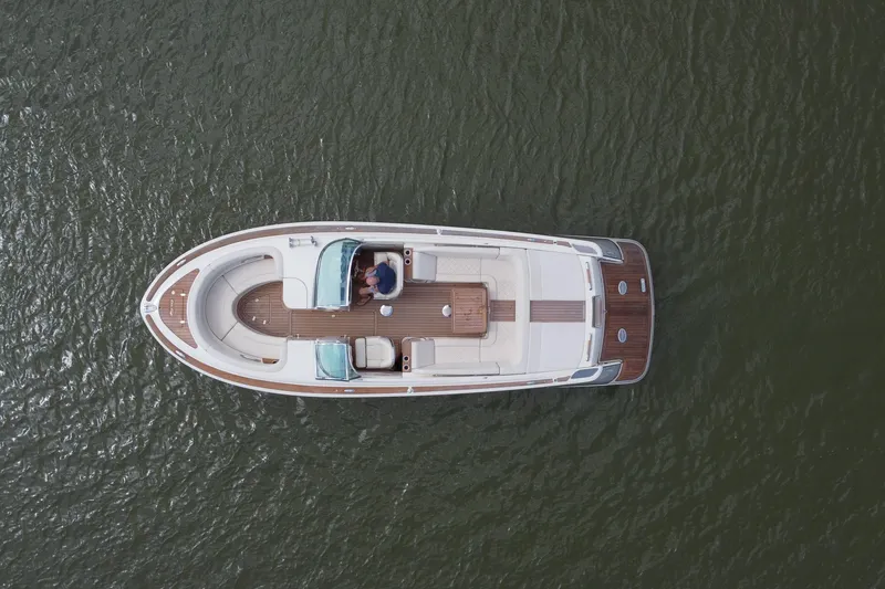 Slide: The Image of Overhead view of 2019 Chris-Craft Launch 30 boat on water. - 15