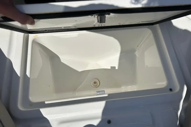 Slide: The Image of Open storage compartment on 2022 Four Winns HD8 OB boat. - 11