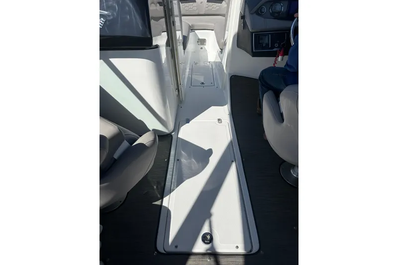 Slide: The Image of 2022 Four Winns HD8 OB boat interior with seating and helm area. - 20