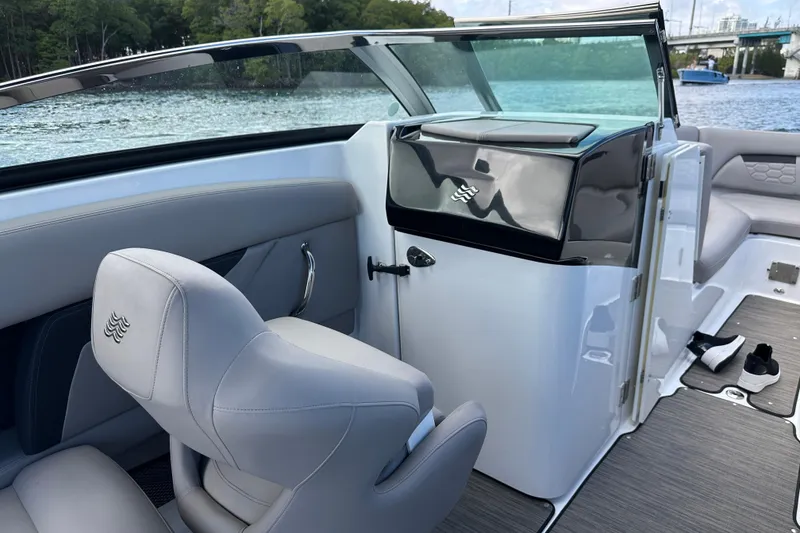 Slide: The Image of 2022 Four Winns HD8 OB boat interior with sleek seating and modern design. - 30