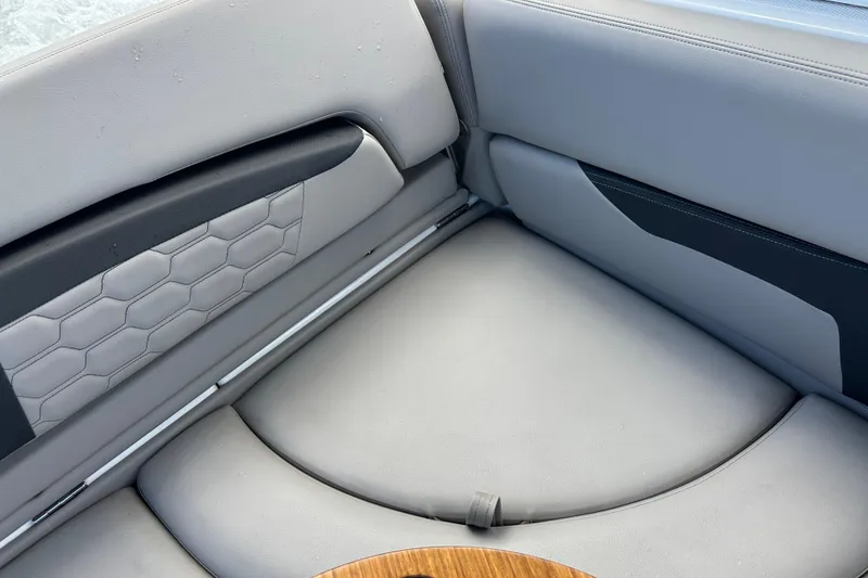 Slide: The Image of 2022 Four Winns HD8 OB boat interior with gray cushioned seating and hexagonal pattern. - 39