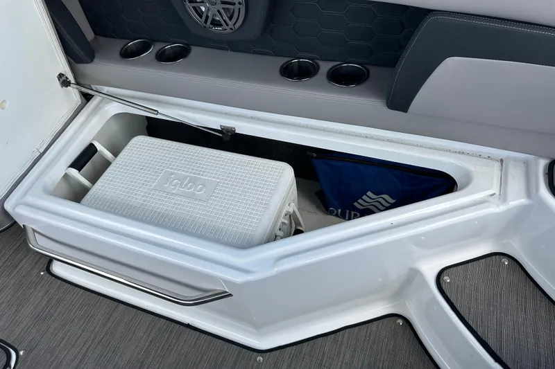 Slide: The Image of Storage compartment with Igloo cooler in 2022 Four Winns HD8 OB boat. - 44