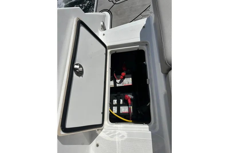 Slide: The Image of 2022 Four Winns HD8 OB boat battery compartment with open hatch. - 54