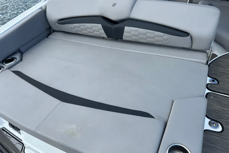 Slide: The Image of 2022 Four Winns HD8 OB boat with spacious, cushioned seating and cup holders. - 60