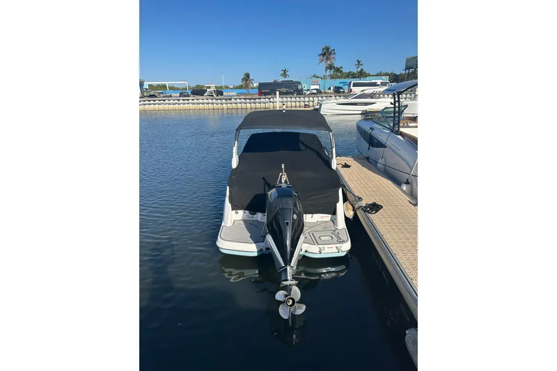 Slide: The Image of 2022 Four Winns HD8 OB boat docked at marina, covered and ready for use. - 67