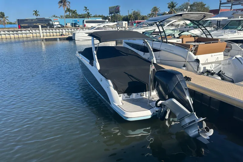 Slide: The Image of 2022 Four Winns HD8 OB boat docked in marina, covered and ready for use. - 69