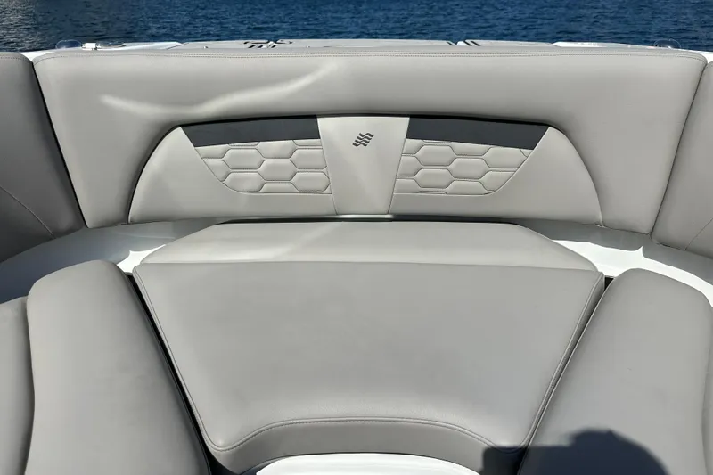Slide: The Image of 2022 Four Winns HD8 OB boat interior with stylish gray seating and hexagonal pattern. - 9