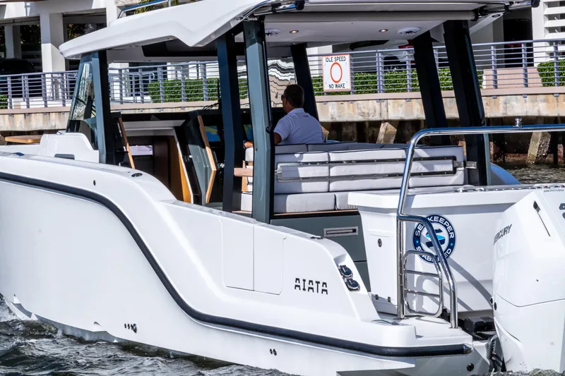 Slide: The Image of Aiata Wayfinder 38 Open 2026, modern motorboat on the water. - 3
