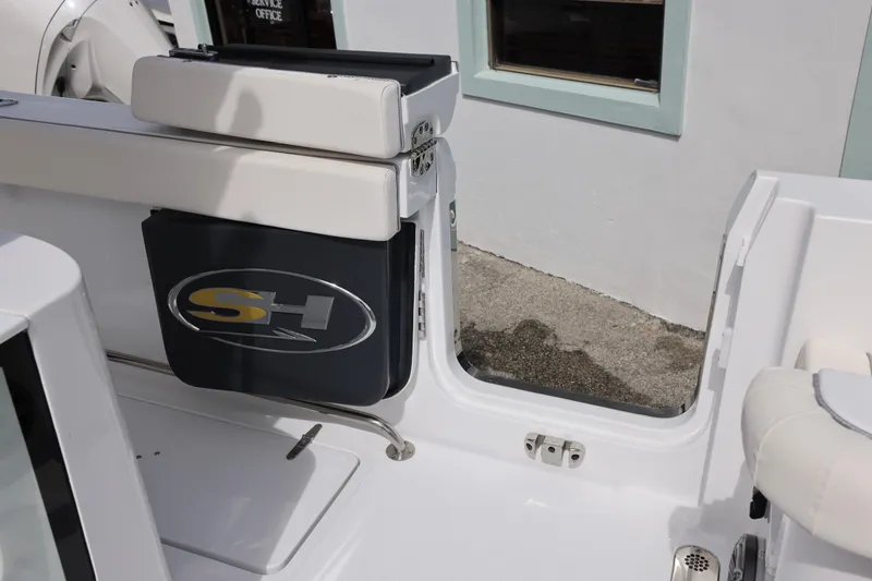 Slide: The Image of Sea Hunt Gamefish 25 boat door, 2026 model, featuring SH logo. - 12