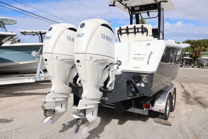 Slide: The Image of 2026 Sea Hunt Gamefish 25 with Yamaha engines on trailer. - 16