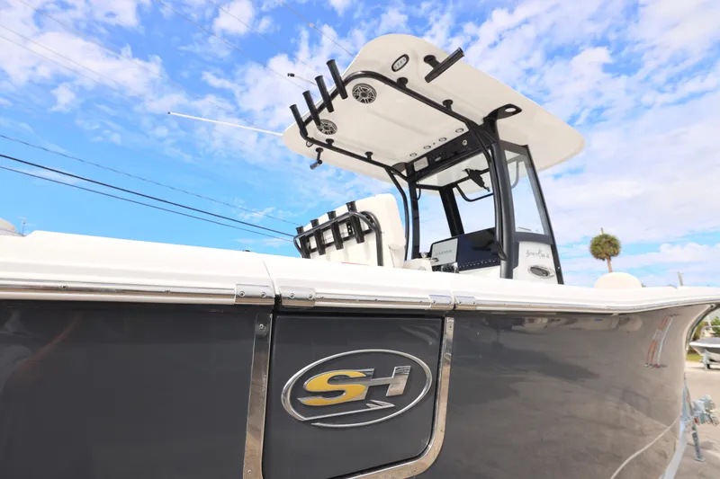 Slide: The Image of 2026 Sea Hunt Gamefish 25 boat under blue sky. - 25