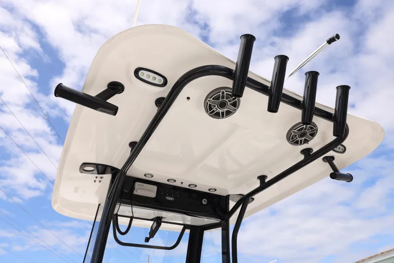 Slide: The Image of Sea Hunt Gamefish 25 2026 boat top with rod holders and speakers. - 6