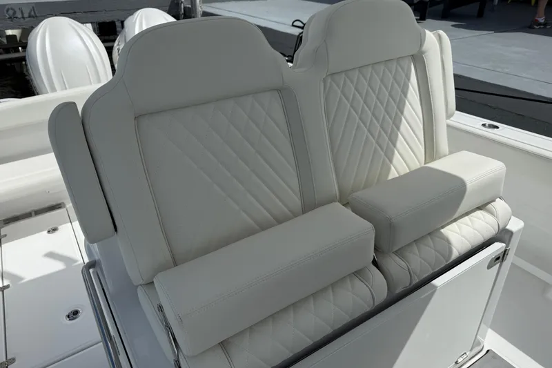 Slide: The Image of Luxurious seating on 2026 Everglades 315 Center Console boat with quilted white upholstery. - 18