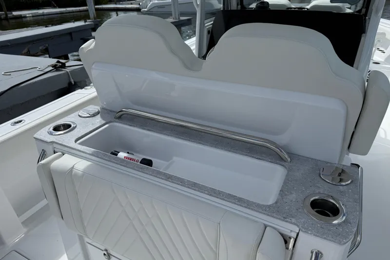 Slide: The Image of 2026 Everglades 315 Center Console boat interior with seating and storage features. - 22