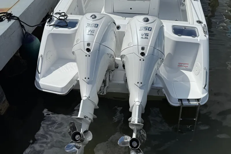 Slide: The Image of 2026 Everglades 315 Center Console with twin 350 V6 outboard engines at dock. - 29