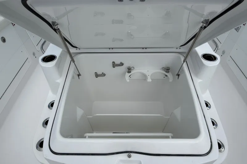 Slide: The Image of Open storage compartment on 2026 Everglades 315 Center Console boat. - 9