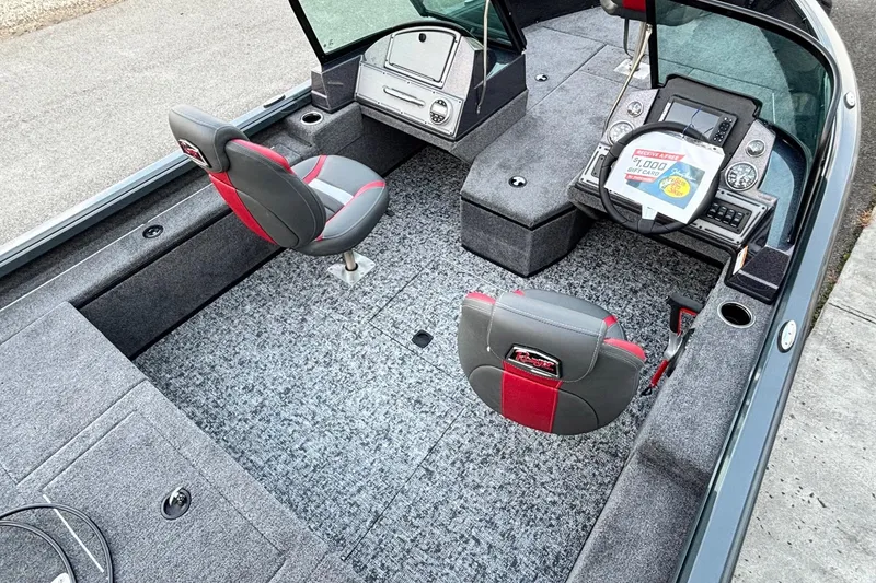 Slide: The Image of 2026 Ranger VS1782SC Reata boat interior with gray and red seating, modern dashboard. - 10