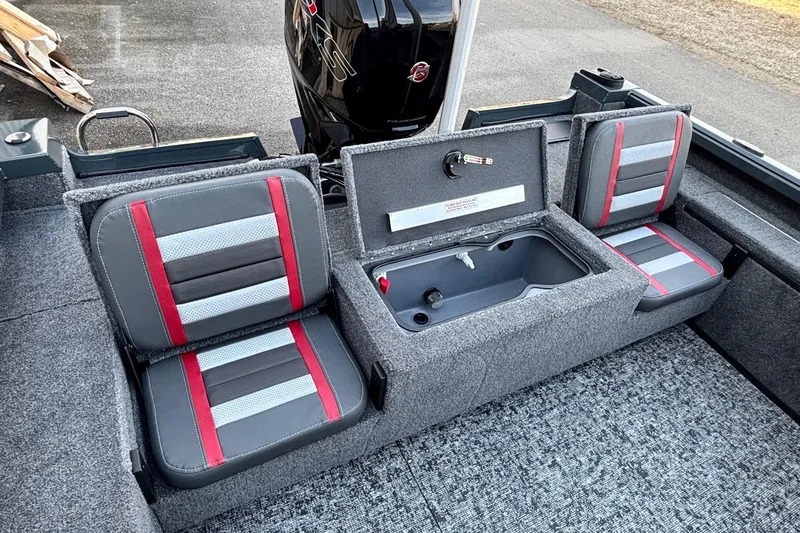 Slide: The Image of 2026 Ranger VS1782SC Reata boat interior with gray and red seating and storage compartment. - 11