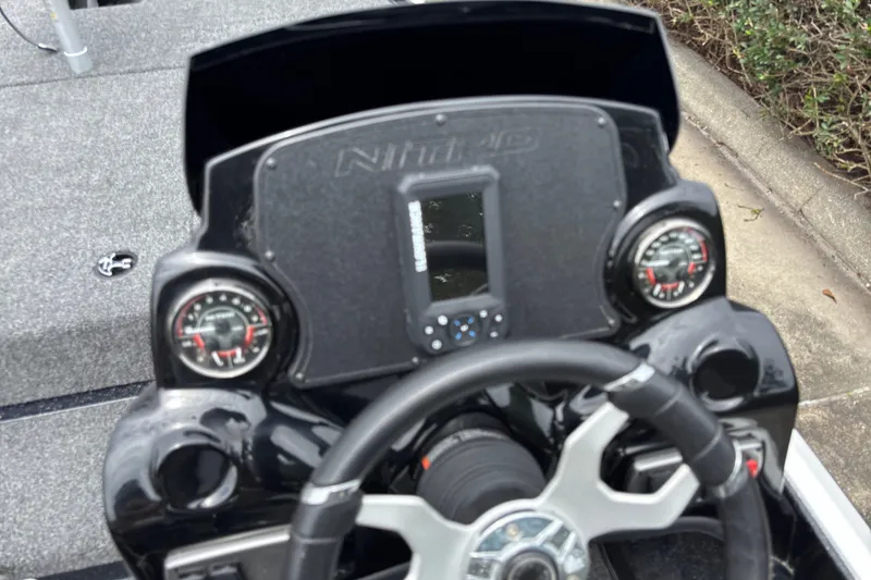 Slide: The Image of Steering console of a 2026 Nitro Z17 boat with gauges and controls. - 116
