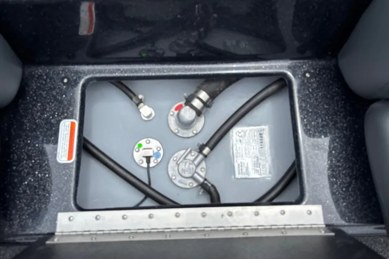 Slide: The Image of Fuel compartment of a 2026 Nitro Z17 boat, showing hoses and connectors. - 24