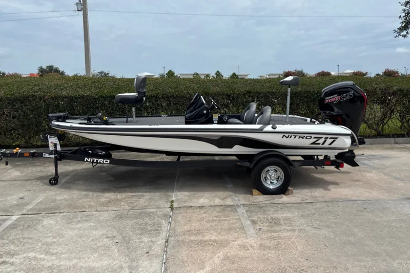 The Image of 2026 Nitro Z17 boat on trailer, parked outdoors, showcasing sleek design and modern features. - 0