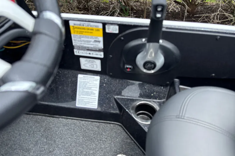 Slide: The Image of Interior of a 2026 Nitro Z17 boat showing steering wheel and control panel. - 14