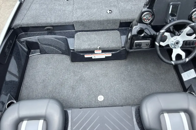 Slide: The Image of Interior of a 2026 Nitro Z17 boat featuring steering wheel and seating. - 15